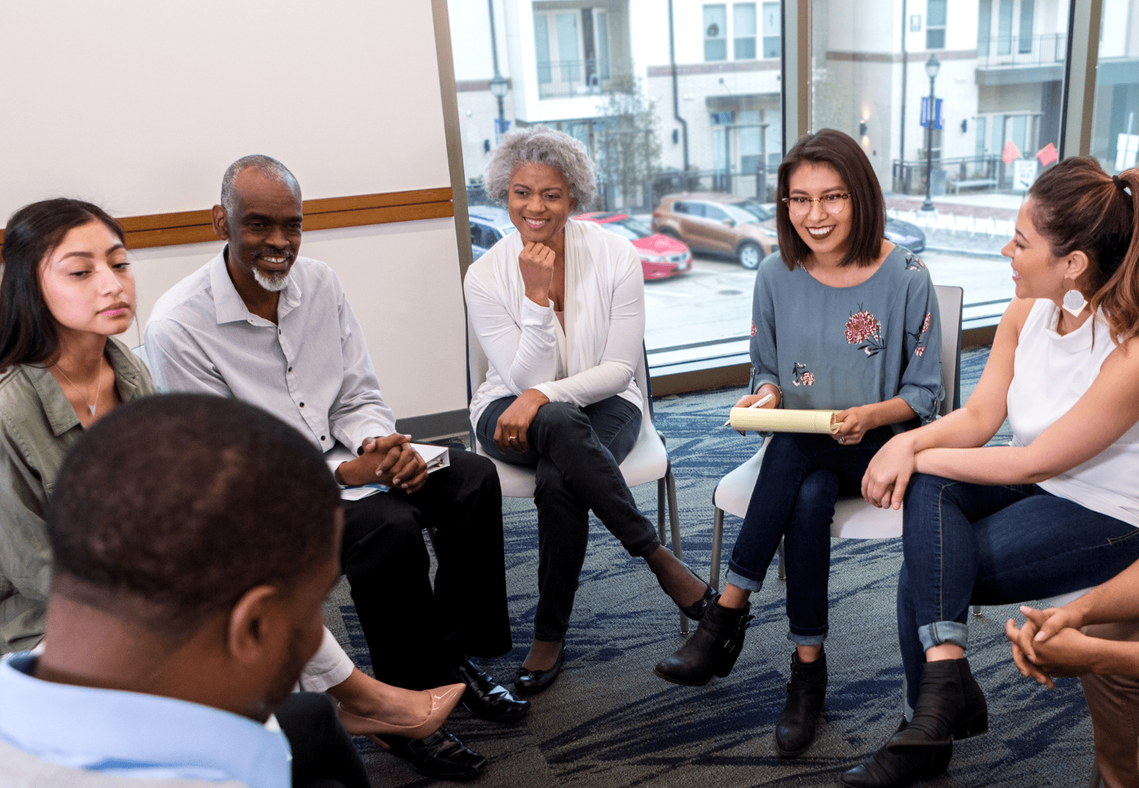 Group of people talking in a circle