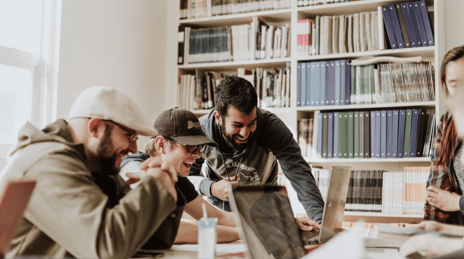 Group working on laptops at a table together