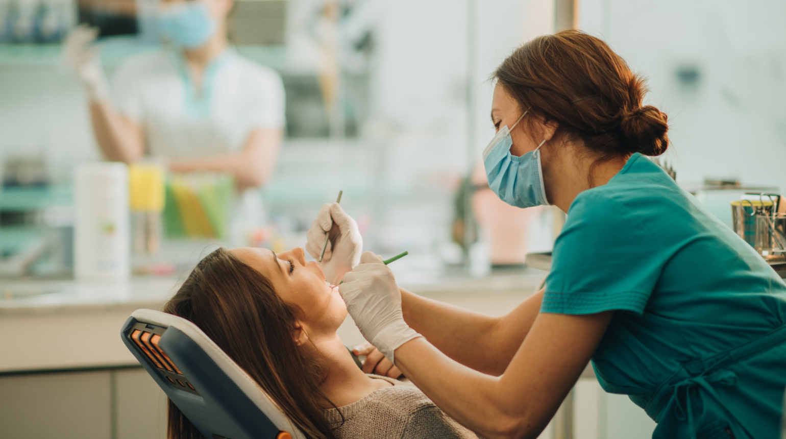 Dentist looking at patient's teeth