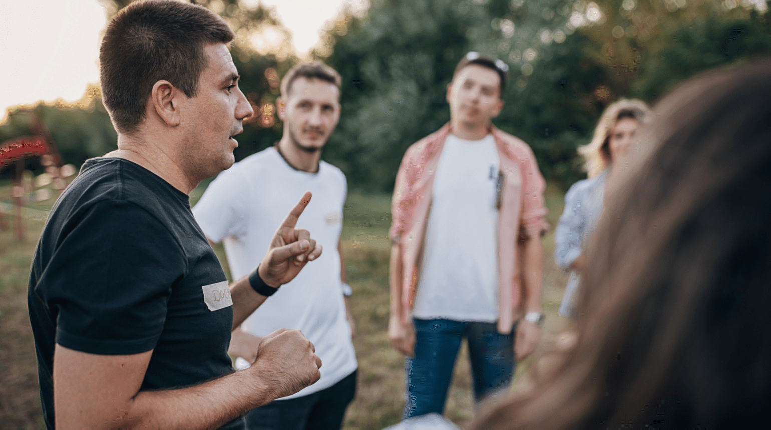 group of people talking outside