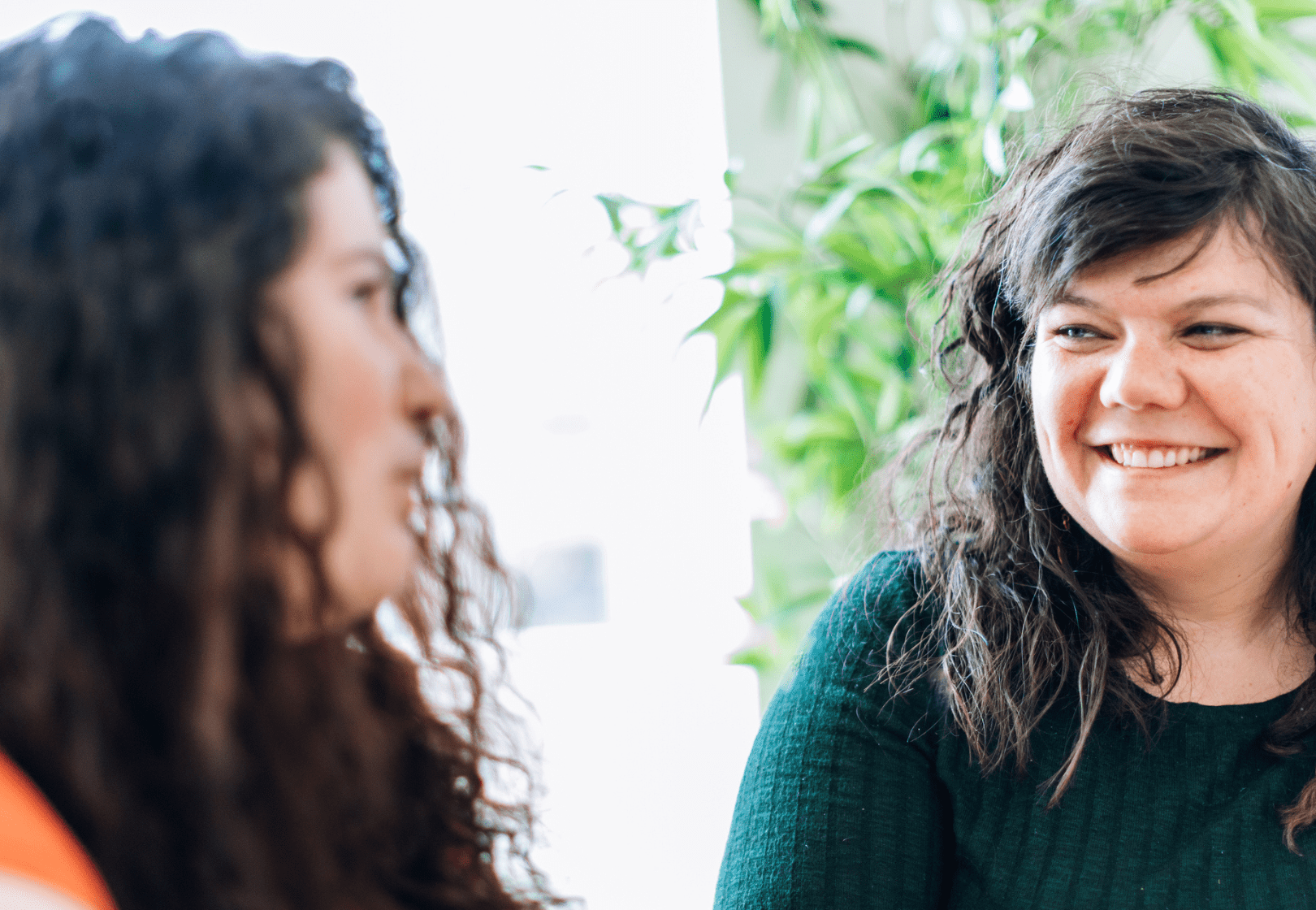 Two women talking and smiling