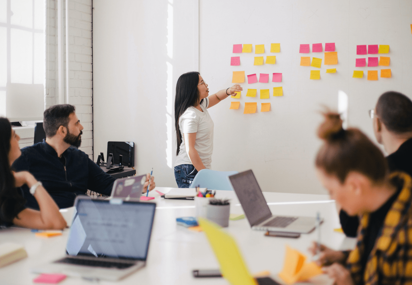 Team brainstorming with sticky notes on the wall