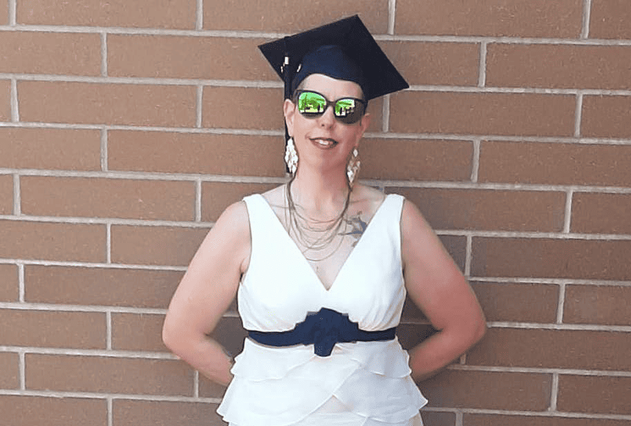 A women wearing a gradation cap.