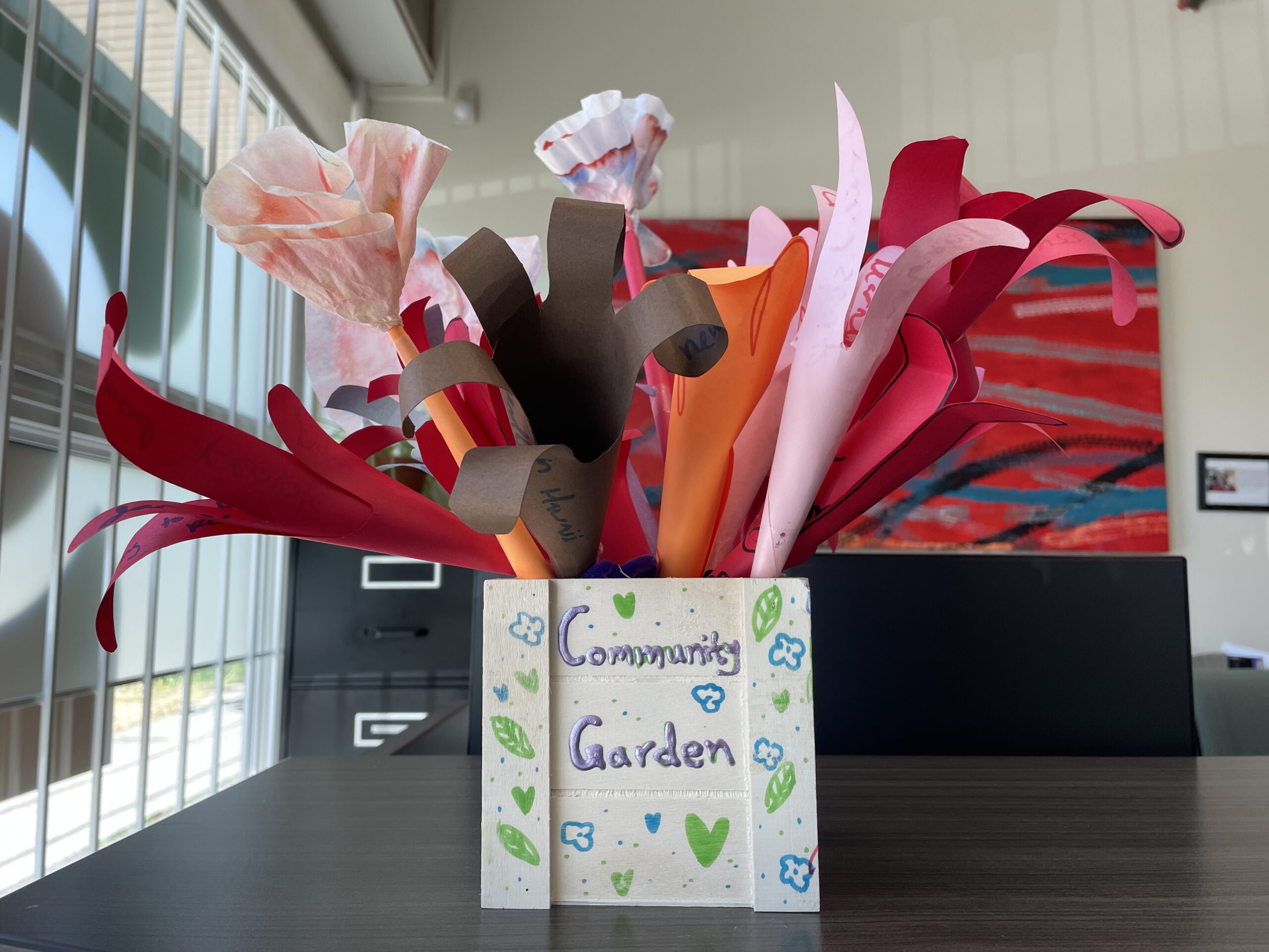 Decorative vase with paper flowers.