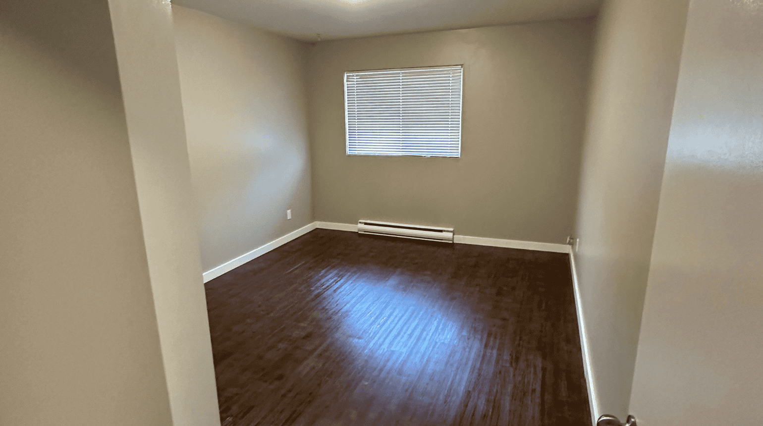 Empty bedroom with window.