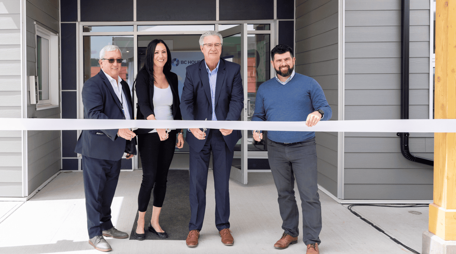 Ribbon cutting at new housing program