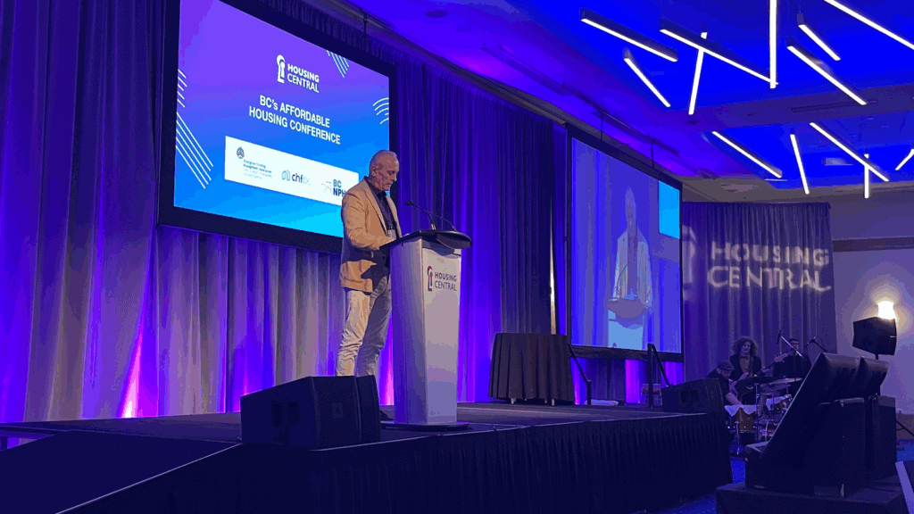 Connective's CEO Mark Miller accepting the Non-Profit Housing Provider of the Year award at the Housing Central Conference. 